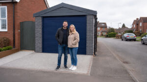 Couple in Front of Precast Concrete Garage